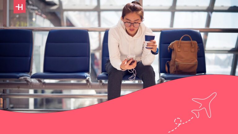 digital nomad in an airport on her phone