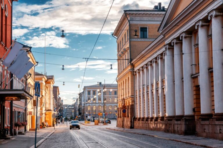 A car drives down a grand street in Helsinki