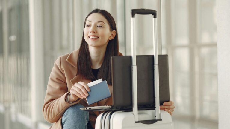 a young woman with her passport and bags at the airport