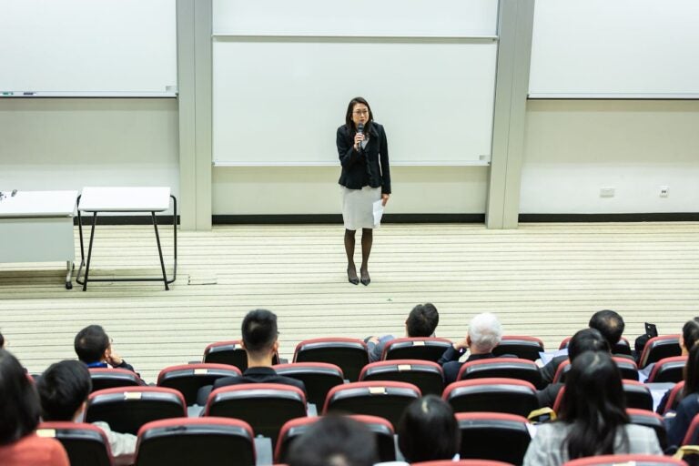 Professor talking to a group of students