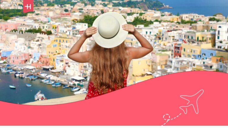 Girl with a white hat admiring the landscape of Naples.