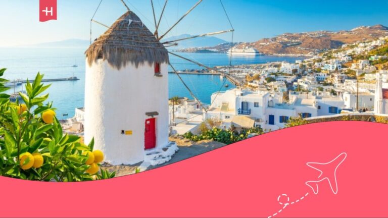 Image of Mykonos with windmill and white houses on the coast.