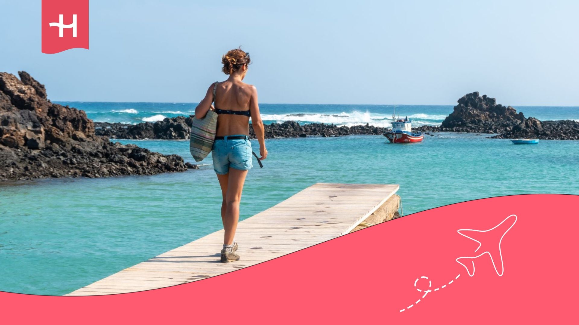 Top coliving spaces in Fuerteventura, Canary Islands: young person on a wooden path on Lobos Island, north coast of the island