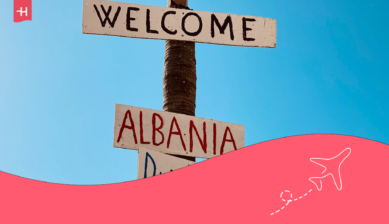 cover image with two wooden welcome boards Albania