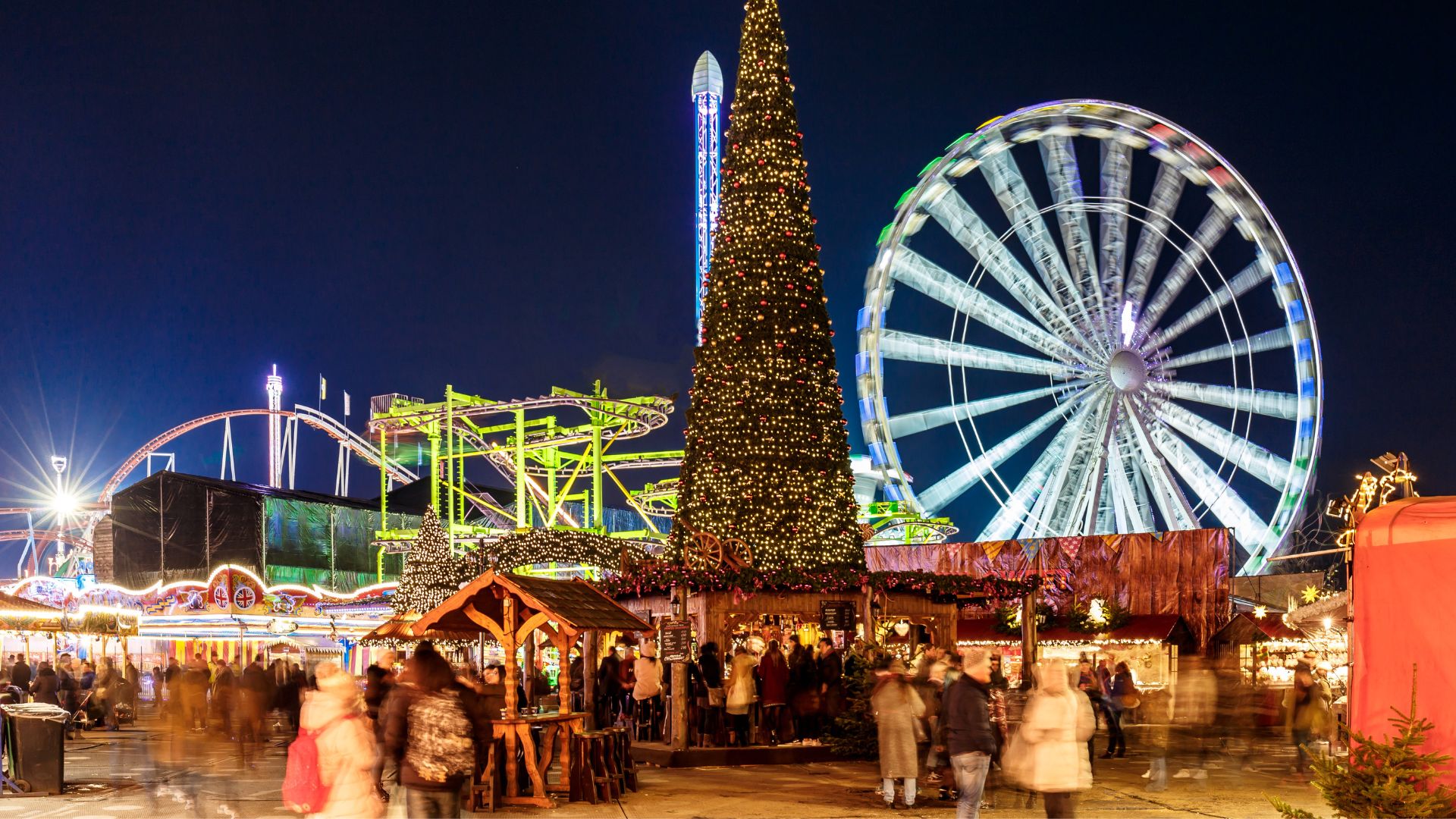 London's Winter Wonderland at night with crowds