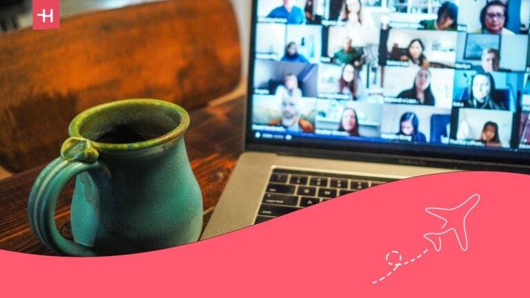 remote team management with a cup of tea or coffee in front of laptop and virtual meeting going on