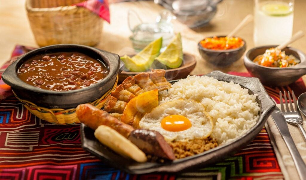 bandeja paisa from medellín served with local spicy sauce