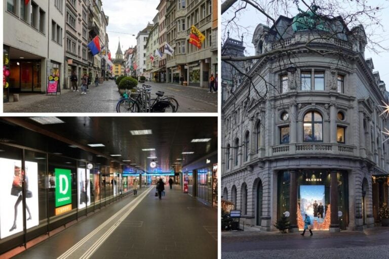 Streets of Switzerland with shops and people walking.