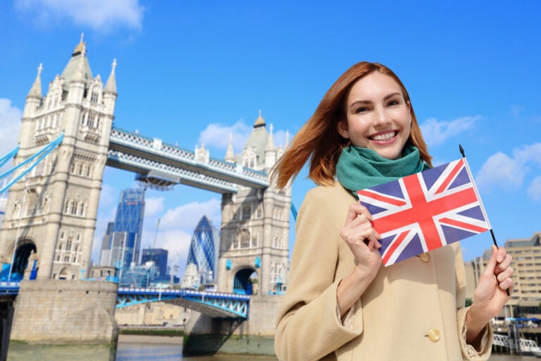 A student holding a Union Jack flag