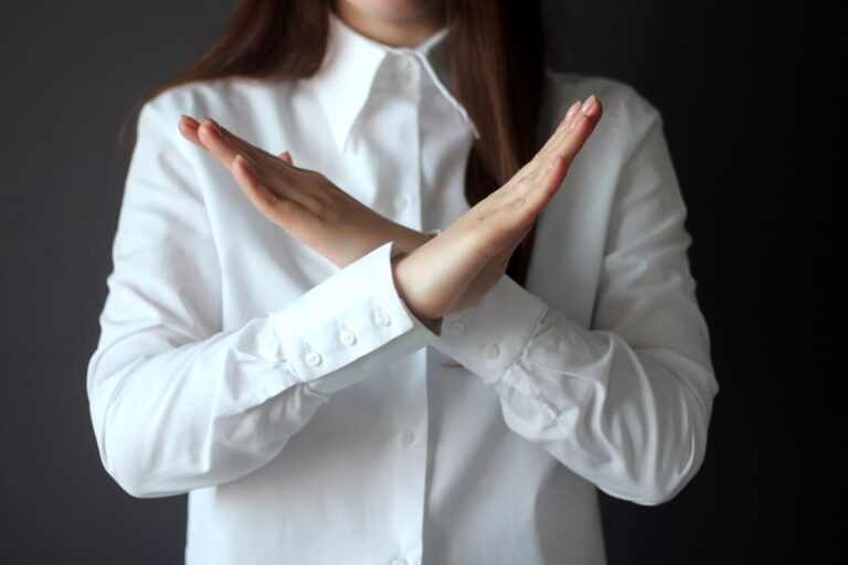 Woman's Hand Showing Reject Stop Break Pause Gesture