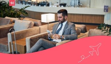 Business traveler relaxing in a premium airport lounge before a long flight