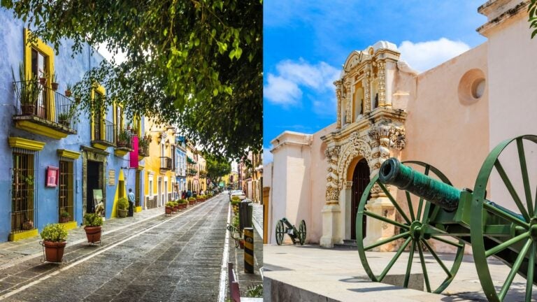 Colorful colonial street and historic fort with cannons in Puebla, Mexico.