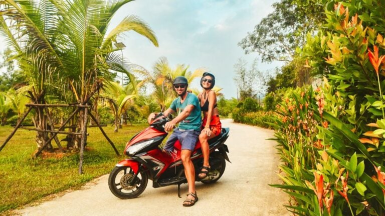 Tourists riding motorcycle in Thailand, Tourists riding motorbike in Thailand