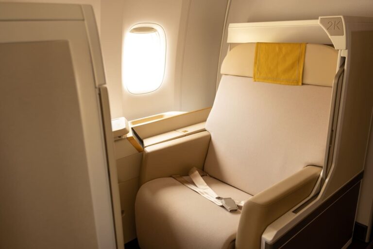 A first-class window seat on an airplane.