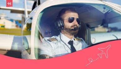 male pilot in the cockpit - best flight schools in the usa
