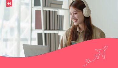 A woman having a flight attendant interview virtually with her laptop.