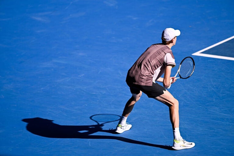 Jannik Sinner competing at the Australian Open 2024 at Melbourne Park during a Grand Slam match