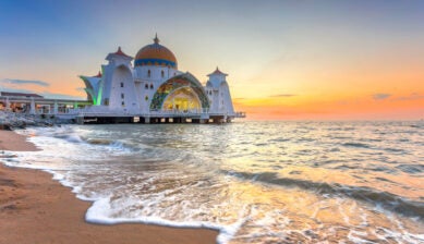 Malacca Straits Mosque in Malaysia during sunset, a scenic travel destination during Ramadan