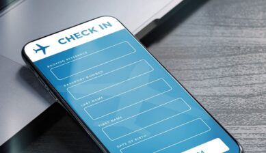 Passenger completing online check-in on airline mobile app and receiving digital boarding pass for international flight