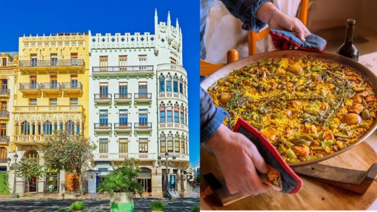 Ornate buildings in central Valencia beside a large pan of traditional paella.