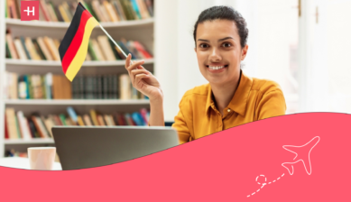 international student in germany holding a flag and applying for loan online