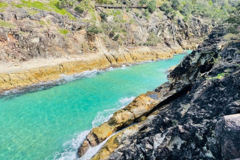 Turquoise ocean, and dramatic cliffs at Point lookout. 
