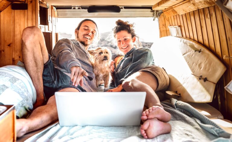 couple and their dog in an rv