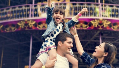 Family enjoying a vacation together at a theme park