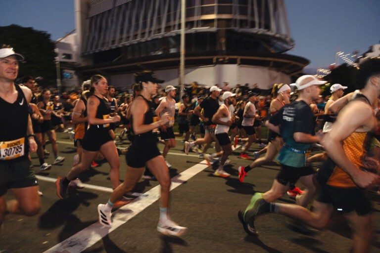 International runners starting the Gold Coast Half Marathon along Australia’s coastal skyline at sunrise