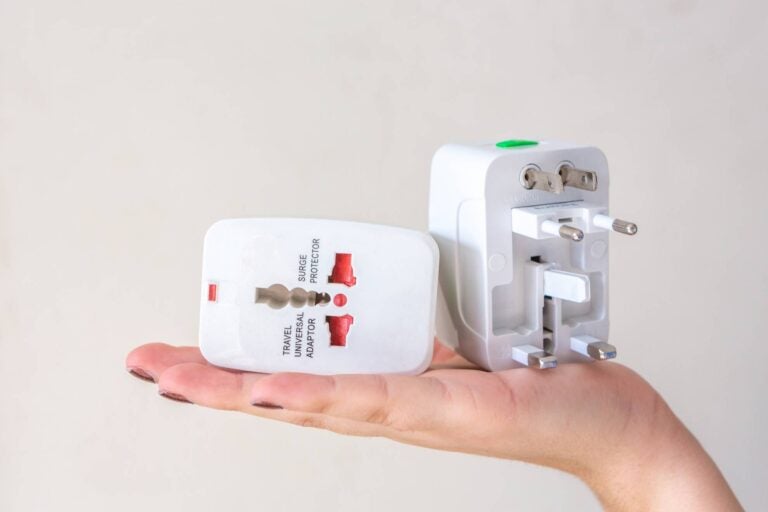 two travel adapters with different plug types