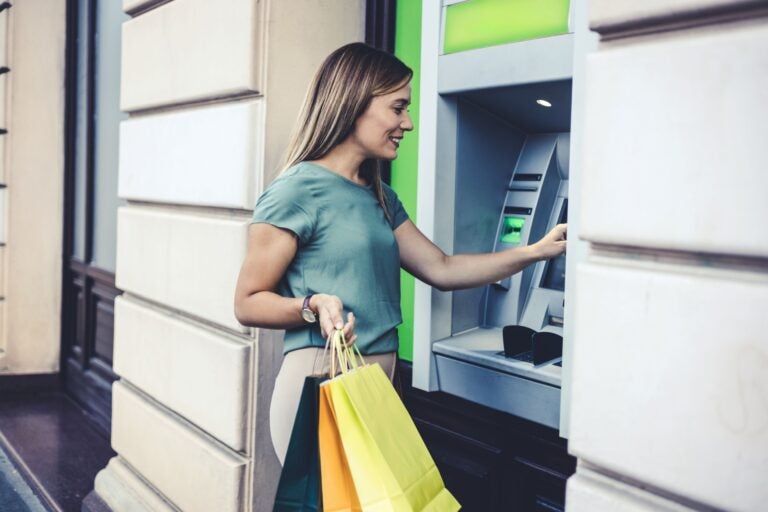 A customer who banks with an U.S. bank using an ATM to shop in another country.