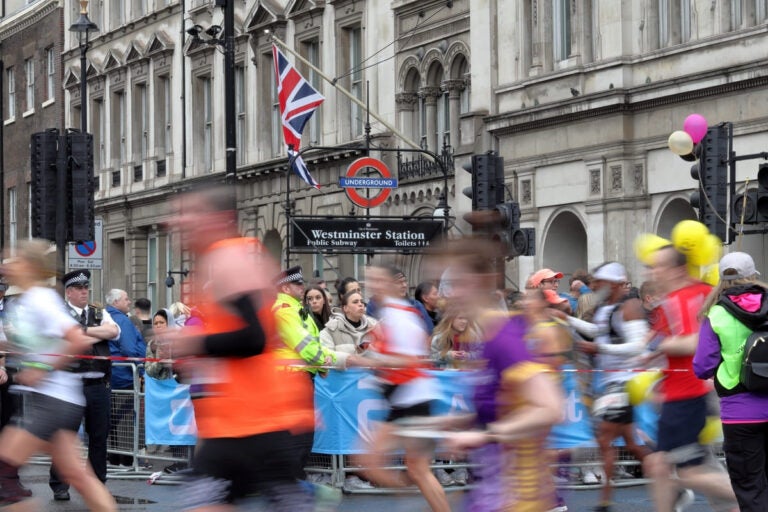 runners crossing tower bridge during the london marathon