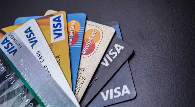 a range of international credit cards with the Visa and Mastercard logos.