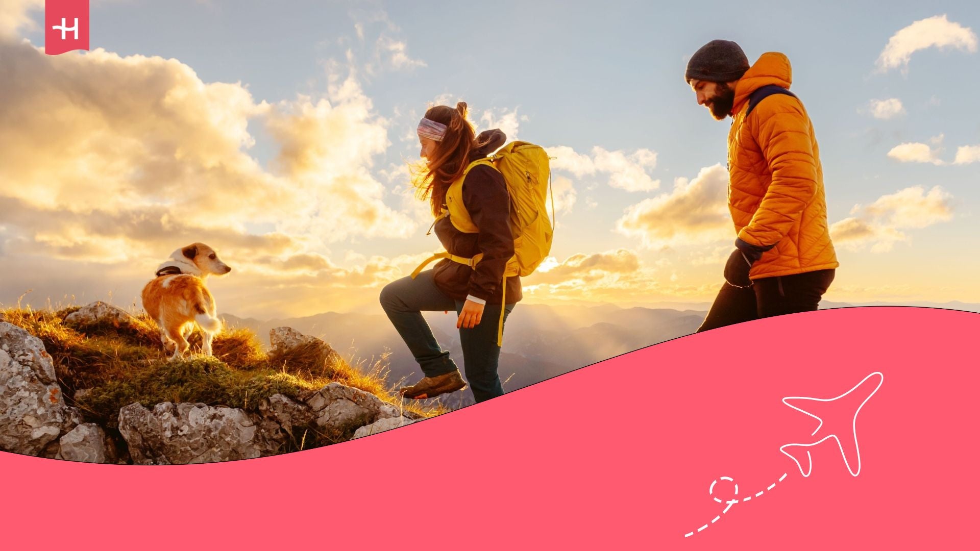 A couple traveling hiking with their dog while traveling through Canada.