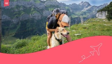 A woman exploring with her dog who she traveled with to Europe.