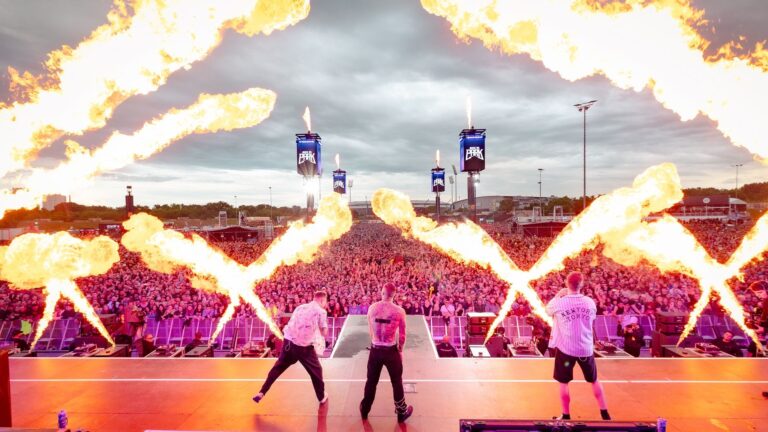 Three performers on stage at Rock am Park.