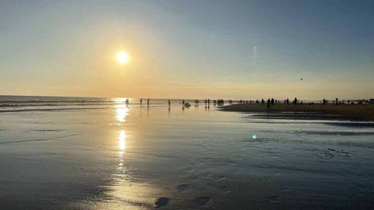 Golden sunset over the ocean at Seminyak beach in Bali, Indonesia