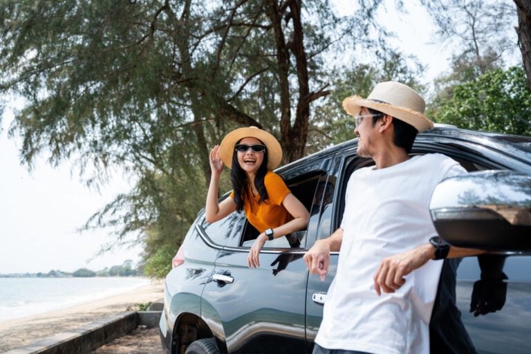 A couple traveling through and exploring Alicante with a car from the best rental car company in Alicante airport.