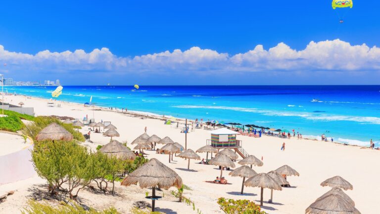 Turquoise waters and white sand at Playa Delfines beach in Cancun, Mexico