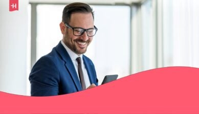 Business professional checking Nomad Enterprise eSIM on his smartphone