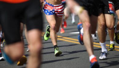 Runners competing in the Boston Marathon along the race route