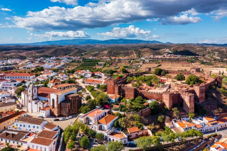 View of Silves town with its famous Moorish castle and cathedral in the Algarve region of Portugal