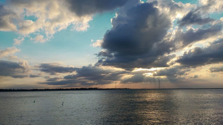 Colorful sunset reflected over Lake Pontchartrain and the Causeway Bridge near New Orleans