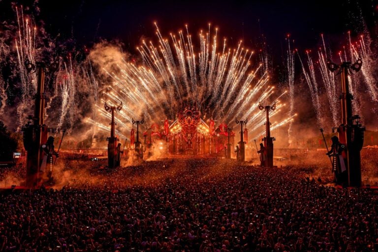 Massive crowd facing stage at Defqon.1 festival.