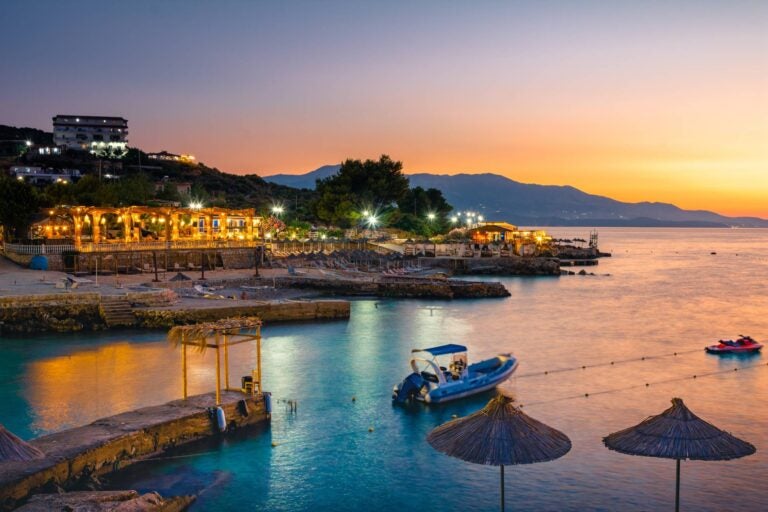 albanian riviera with a beach club during the sunset