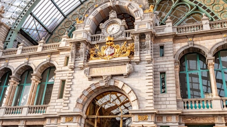 The ornate arched interior of Antwerpen Centraal railway station in Belgium