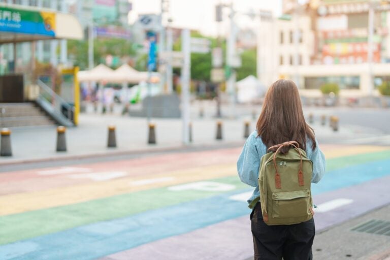 Tourist sightseeing at rainbow crosswalk in Ximending, Taipei City.