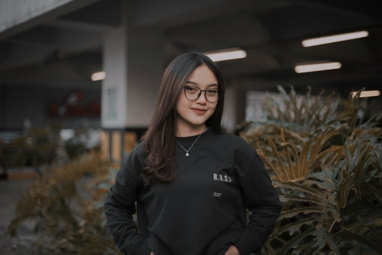 Alt text: Young international student doing internship abroad in a global company.
