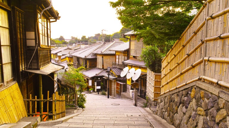 Traditional stone-paved street of Ninen-zaka lined with wooden machiya townhouses in Kyoto, Japan