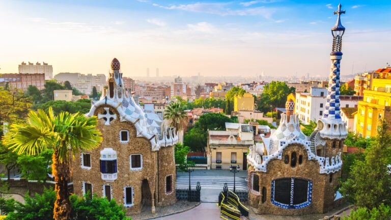 Panoramic view of Barcelona city skyline seen from the terrace at Park Güell in the early morning, Spain